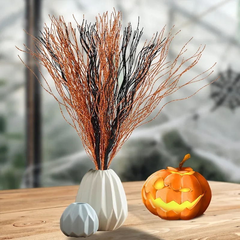 Decoración floral con polvo dorado y bayas negras y naranjas - imagen 4