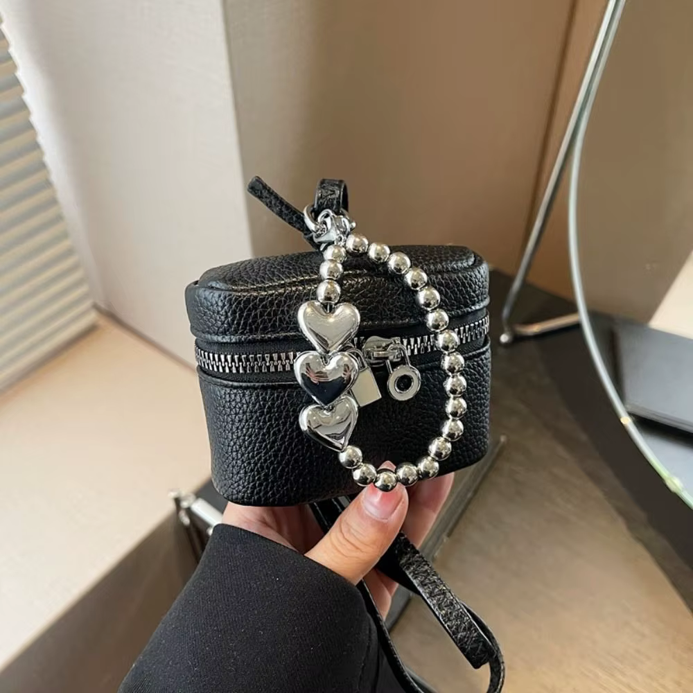 Bolso bandolera con compartimento para auriculares