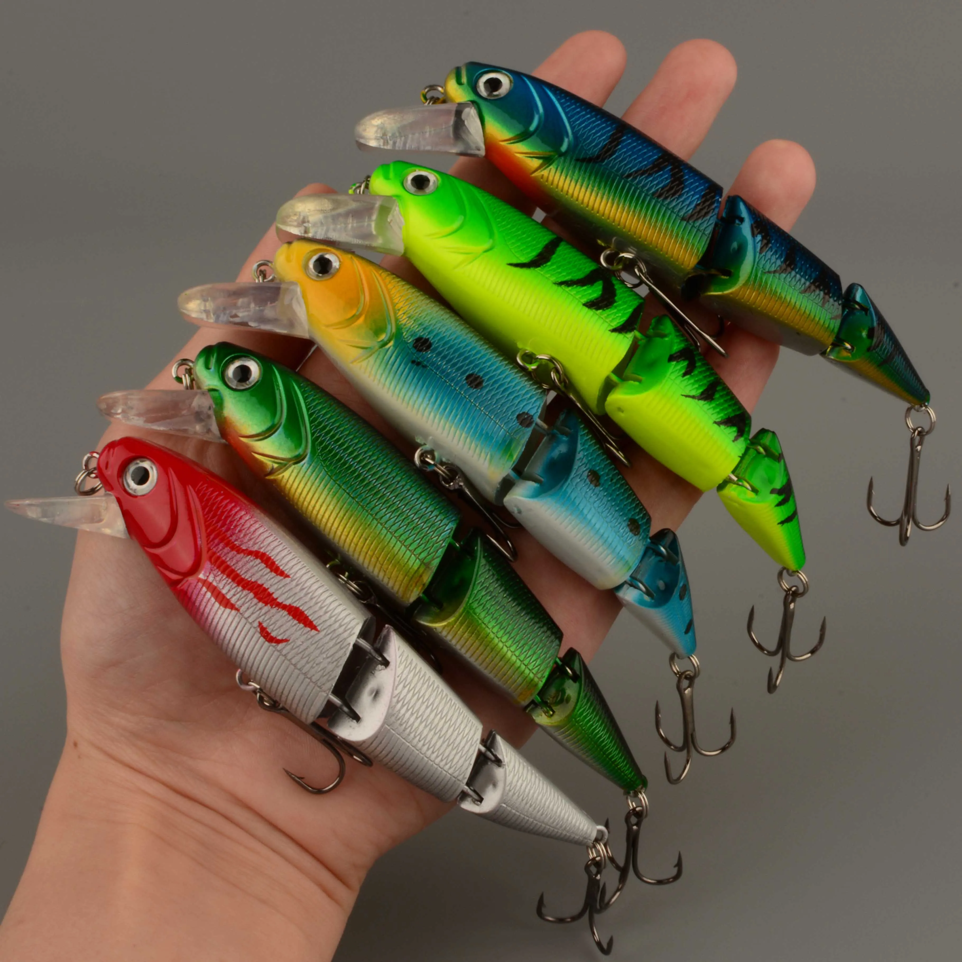 Señuelo de pesca duro multisección para lubina con ojos 3D