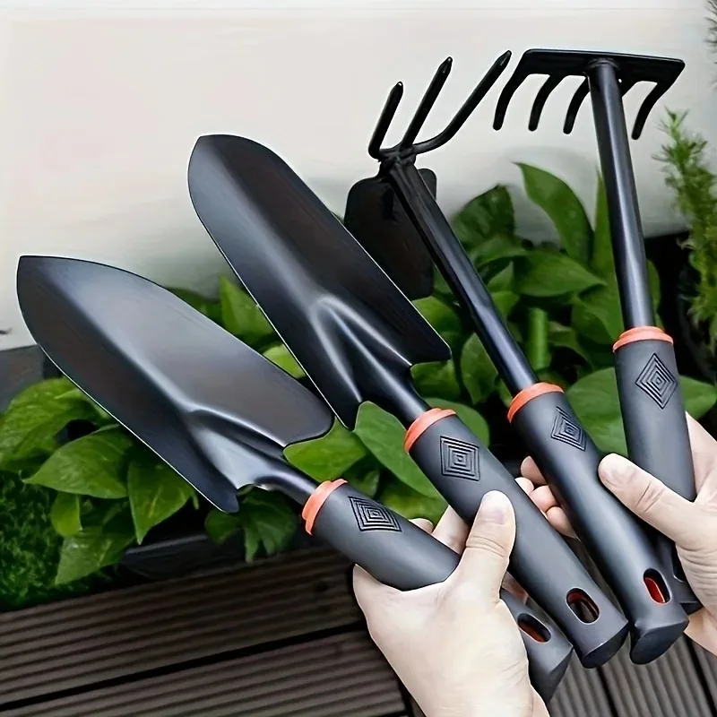 Paleta de jardinería de metal con mango ergonómico negro y detalles naranjas