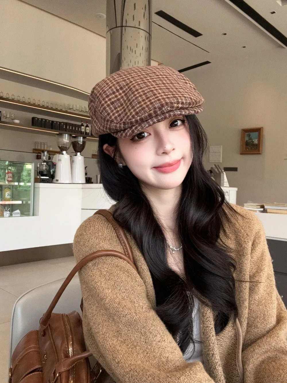 Gorra en tonos negro/verde/marrón con look vintage