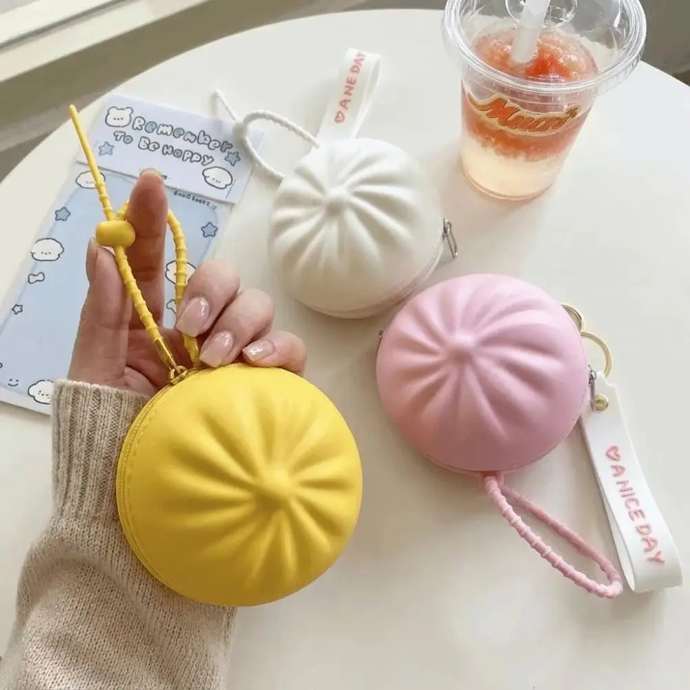 Monedero de silicona con forma de bollo y correa de muñeca