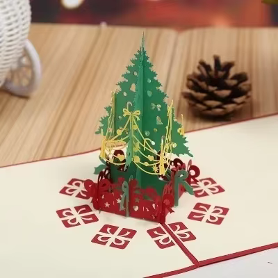 Tarjeta 3D pop-up abierta mostrando el diseño con corte láser