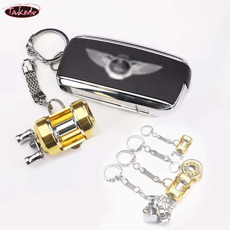 Llavero carrete de pesca metálico TAKEDO – Spinning y casting