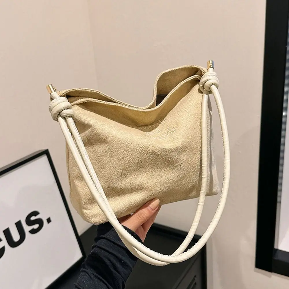 Bolso multicolor con textura tipo gamuza