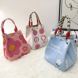 Bandolera tejida con motivo floral y asa ancha para mujer y niña