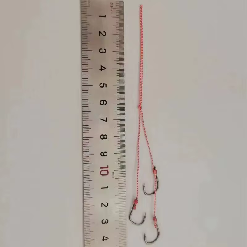 Señuelo jig con pluma de acero al carbono y anzuelo con púas