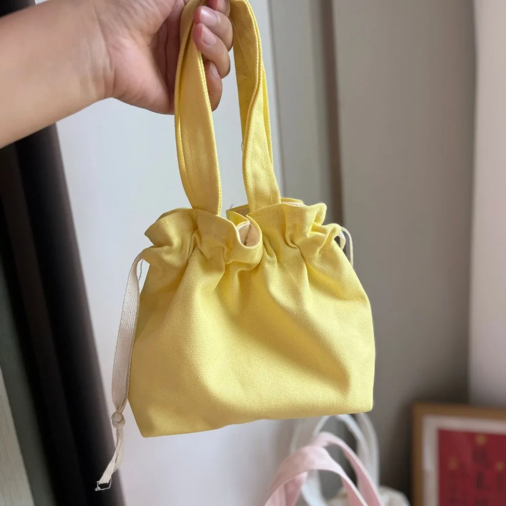 Bolso de lona portátil en tonos variados