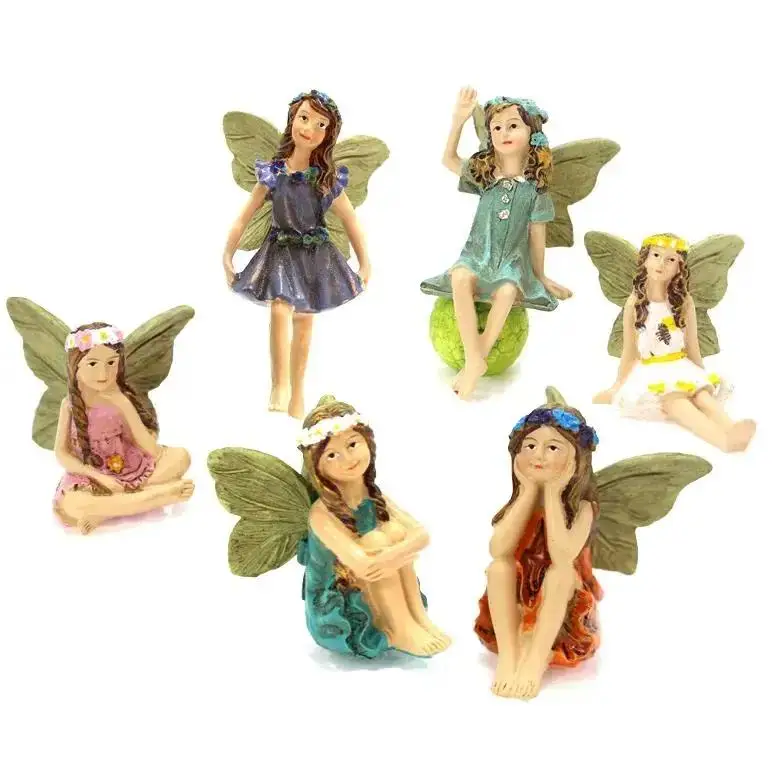 Muñeca hada con alas y acabado decorativo